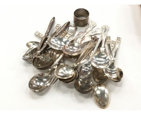 An engine turned silver serviette ring together with a silver dessert fork and silver plated cutlery.