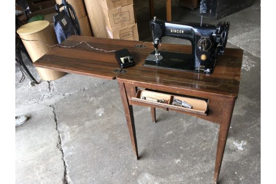 A Singer Sewing Machine Fitted In Walnut Flip Top Table With Drop