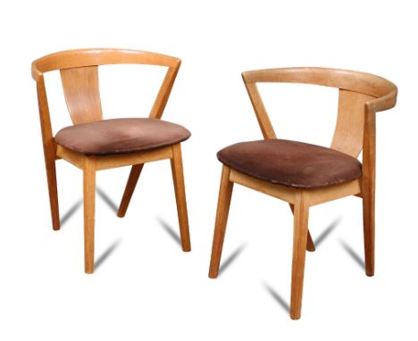 A set of four light oak 'Put-U-Up' dining chairs by Greaves & Thomas, each with a curved back and seat on square tapering leg