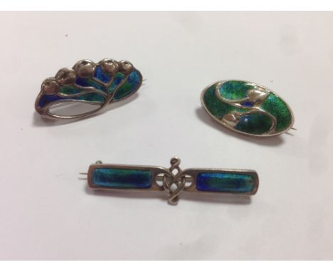 Murrle Bennett & Co., (1896-1914), two Art Nouveau German metalwares and enamel brooches, together with another similar brooc