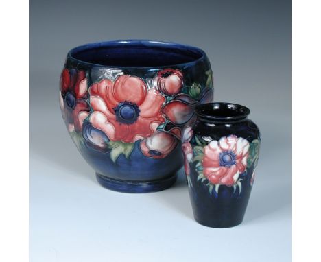 A Moorcroft Anemone pattern planter, decorated to a blue ground, together with a simliar small vase, painted and impressed ma