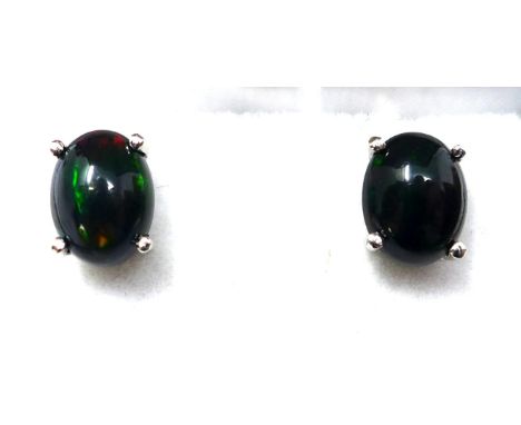 A boxed pair of sterling silver black Ethiopian opal cabochon stud earrings (flashes of blue, green and orange) 1.2g 