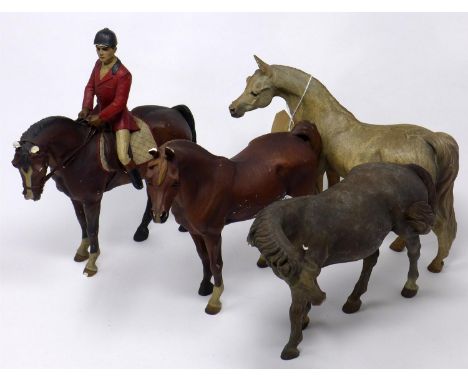 Three ceramic horses marked NL '92 together with a resin example 