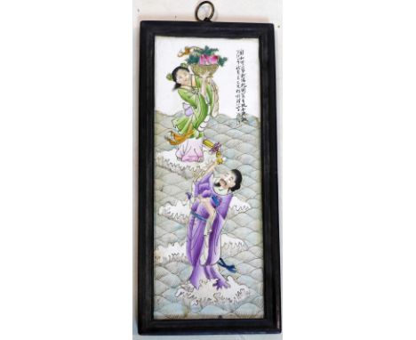 A Chinese ceramic plaque, depicting two figures on water, in ebonised frame, 41 x 15cm 