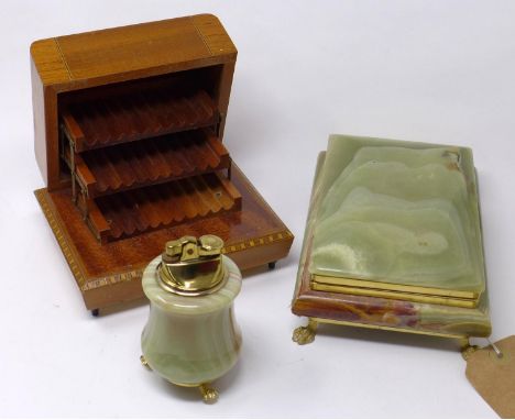 An onyx and gilt metal casket together with an onyx lighter and a musical cigarette box 