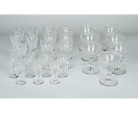 A SET OF TWELVE CUT CRYSTAL STEMWARE, SOME WATERFORD, IRELAND 20TH CENTURYcomprising seven champagne glasses, seven cordial g