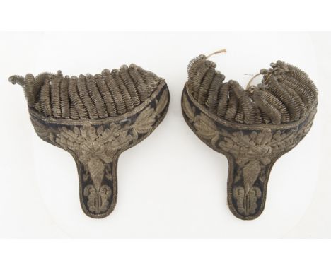 A PAIR OF REVOLUTIONARY EPAULETTESa pair of black and silver embellished epaulettes, with a foliate and floral design embroid