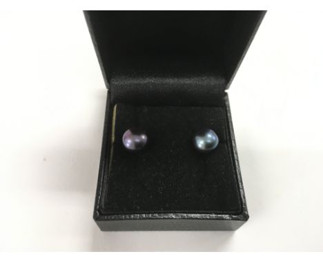A pair of dark irridescent cultured pearl earrings with 9ct gold backs.