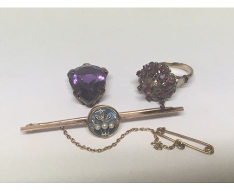 An 18carat gold bar brooch decorated with enamel and raised seed pearl an amethyst pendent and a ring set with rose Quartz. (