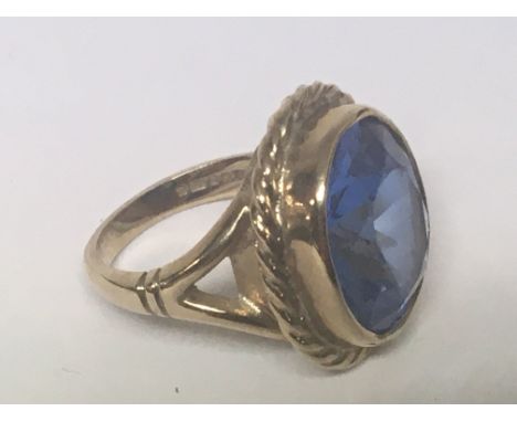 A 9carat gold ring set with a good size cut blue Quartz. Weight 7.5g ring size K-L