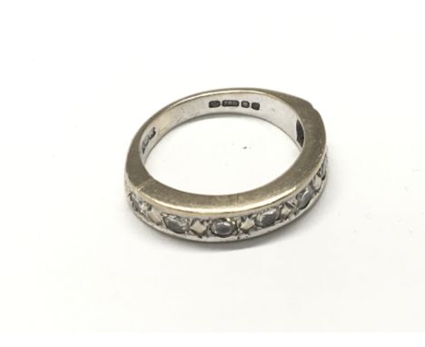 An 18carat white gold half hoop eternity ring set with a row of seven diamonds