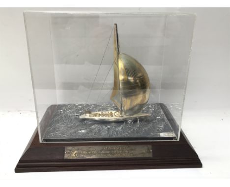 A cased silver and gilt model of 12 Meter Americaâ€™s Cup yacht Stars &amp; Stripes 87, the yacht shown sailing under spinnak