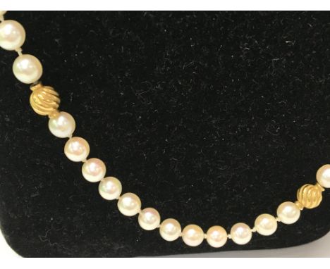 A Pearl necklace with 18 ct gold clasp.
