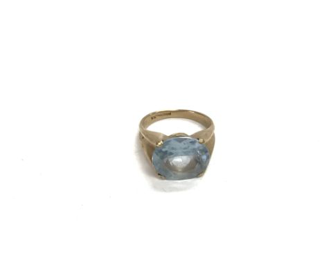 A 9ct gold ring set with a central topaz, approx 7.5g and approx size O.