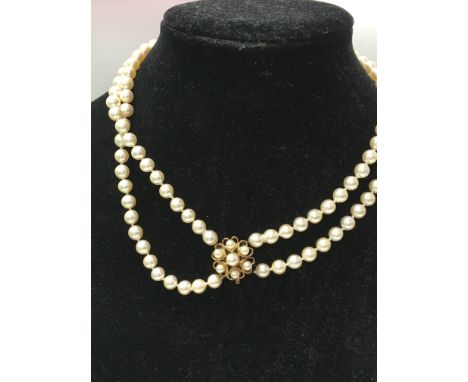 A double pearl necklace with 9 ct gold clasp .