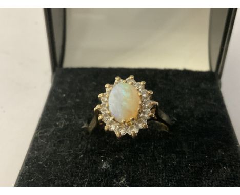 A 9ct gold Opal and white stone ring, N.