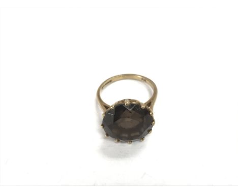 A gold ring, possibly 9ct as marks are unclear, set with a quartz stone, approx 4.8g and approx size P.