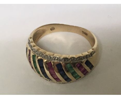 A 14carat gold ring set with rows of Emerald ruby and sapphire weight 4.2g