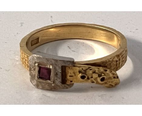 A vintage 18ct yellow and white gold belt design ring set with a square cut ruby. Approx 3.6g.