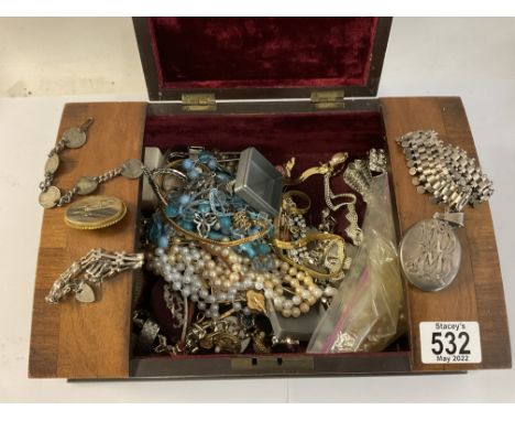 A box of mixed vintage costume jewellery, including a large white metal choker necklace and locket.