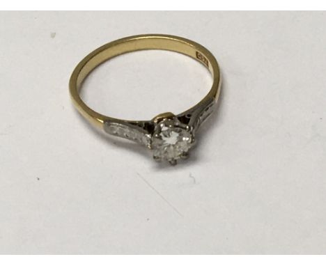 A 18 ct gold ring inset with single small diamond and one other unmarked ring ,