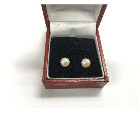 A pair of pearl stud earrings with 9ct gold clasps.
