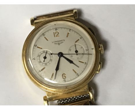 A vintage 18 ct Longines chronograph wrist watch with later strap working order .