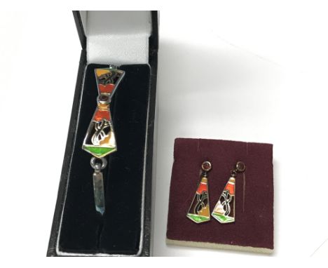 A matching sterling silver and enamel bracelet and earrings by Clarice Cliff.