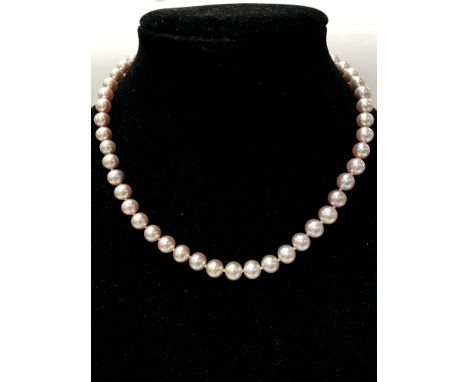 A freshwater cultured pink Pearl strung necklace with a 9ct yellow gold ball clasp.