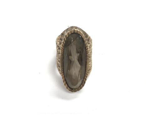 A 9ct gold ring set with an oval smoky quartz stone, approx 10.8g and approx size P.