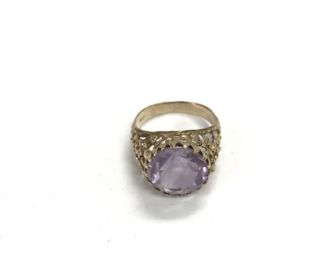 A 9ct gold ring set with a central amethyst, approx 5g and approx size P-Q.