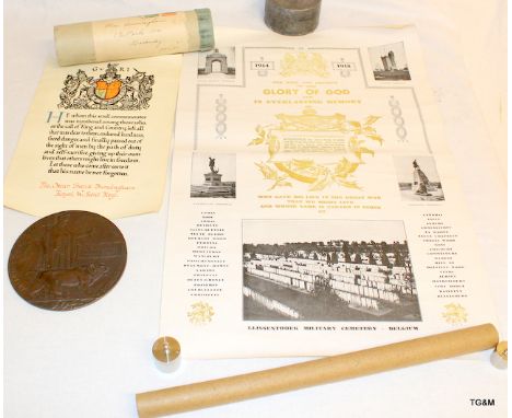 A WW1 Memorial plaque with its original parchment scroll and unique scroll having a newspaper cutting attached awarded to Osc