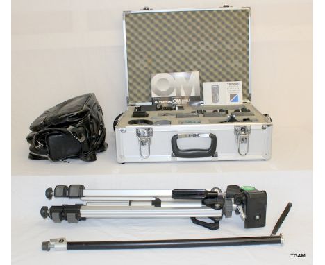 A boxed set of Photography equipment to include Olympus OMI (N) motor drive, 3 lenses and a 2 x tele converter, a camera bag,