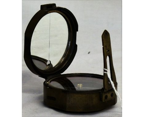 A round Brunton Compass