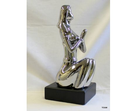A ceramic figure of an Art Deco style lady