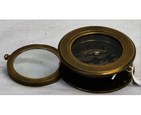 A compass with magnifying glass
