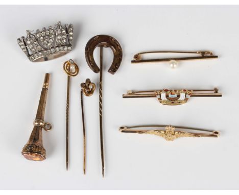 A gold and enamelled bar brooch, designed as a navy crown, detailed '9ct', width 5.1cm, a gold bar brooch, designed as the Ro