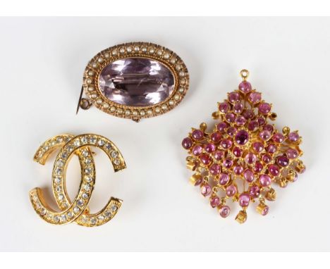 A 9ct gold mounted amethyst and seed pearl brooch, collet set with the oval cut pale amethyst within a surround of seed pearl