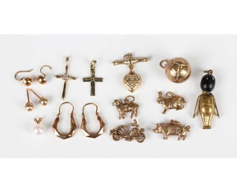 Five 9ct gold charms, including a pig and a rabbit, total weight 5g, two gold pendant crosses, unmarked, a gold pendant heart