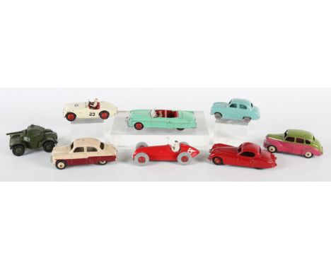 Seven Dinky Toys cars, comprising No. 164 Vauxhall Cresta, No. 157 Jaguar, No. 109 Austin Healey, No. 152 Austin Devon, green