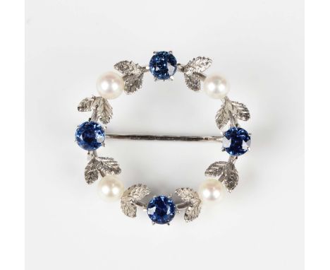 A sapphire and cultured pearl brooch, designed as a wreath, unmarked, weight 2.6g, width 2.4cm.Buyer’s Premium 29.4% (includi