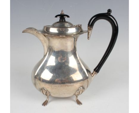 An Edward VIII silver hot water pot of oval baluster form, on scroll legs, Birmingham 1936 by Aaron Lufkin Dennison, weight 4