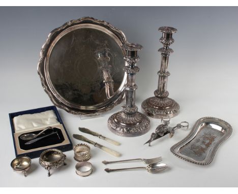A pair of 19th century Sheffield plate telescopic candlesticks, each with a detachable nozzle above a cylindrical stem and ci