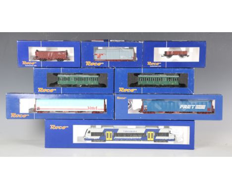 A collection of Roco gauge HO railway items, including No. 63183 WEG-VT 445, No. 63017 OBB 5081/6581.02 two car set, four coa