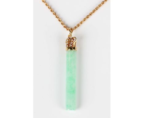 A gold, jade and diamond pendant, the cylindrical jade rod with a diamond surmount designed as a coronet, detailed '585', len
