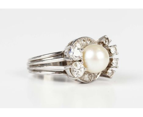 A white gold, cultured pearl and diamond ring in an abstract design, mounted with a single cultured pearl to the centre, othe