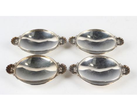 A set of four Georg Jensen sterling dishes, designed by Gundorph Albertus, each of circular form with scallop shell shaped ta