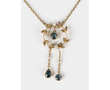 An Edwardian gold, seed pearl and aquamarine pendant necklace, designed as a wreath, the front with two graduated drops, on a