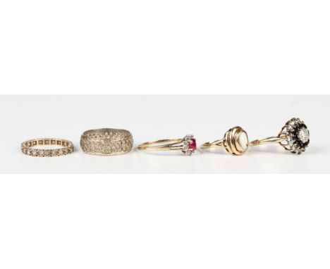 A 9ct gold, ruby and diamond cluster ring, ring size approx U, a gold and synthetic spinel eternity ring, detailed '9ct', a 9