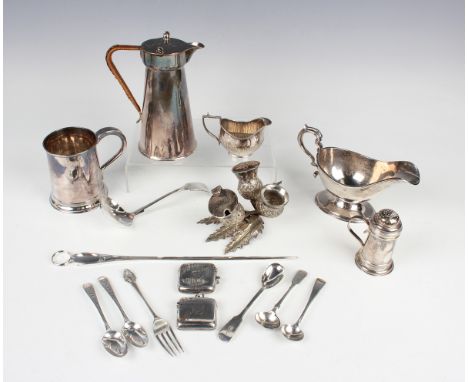 A George V silver sauceboat with scroll handle, Sheffield 1927, length 17.5cm, a Britannia silver caster with pierced domed l